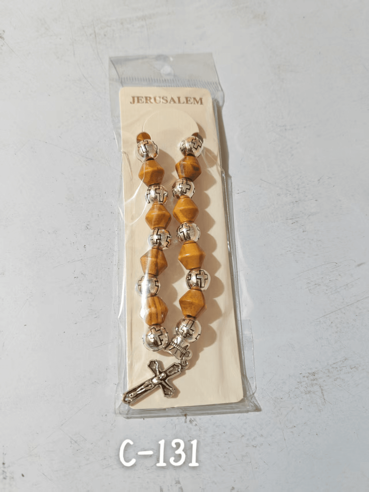 Cross Bead Stretch Bracelet with a beaded design and cross accent