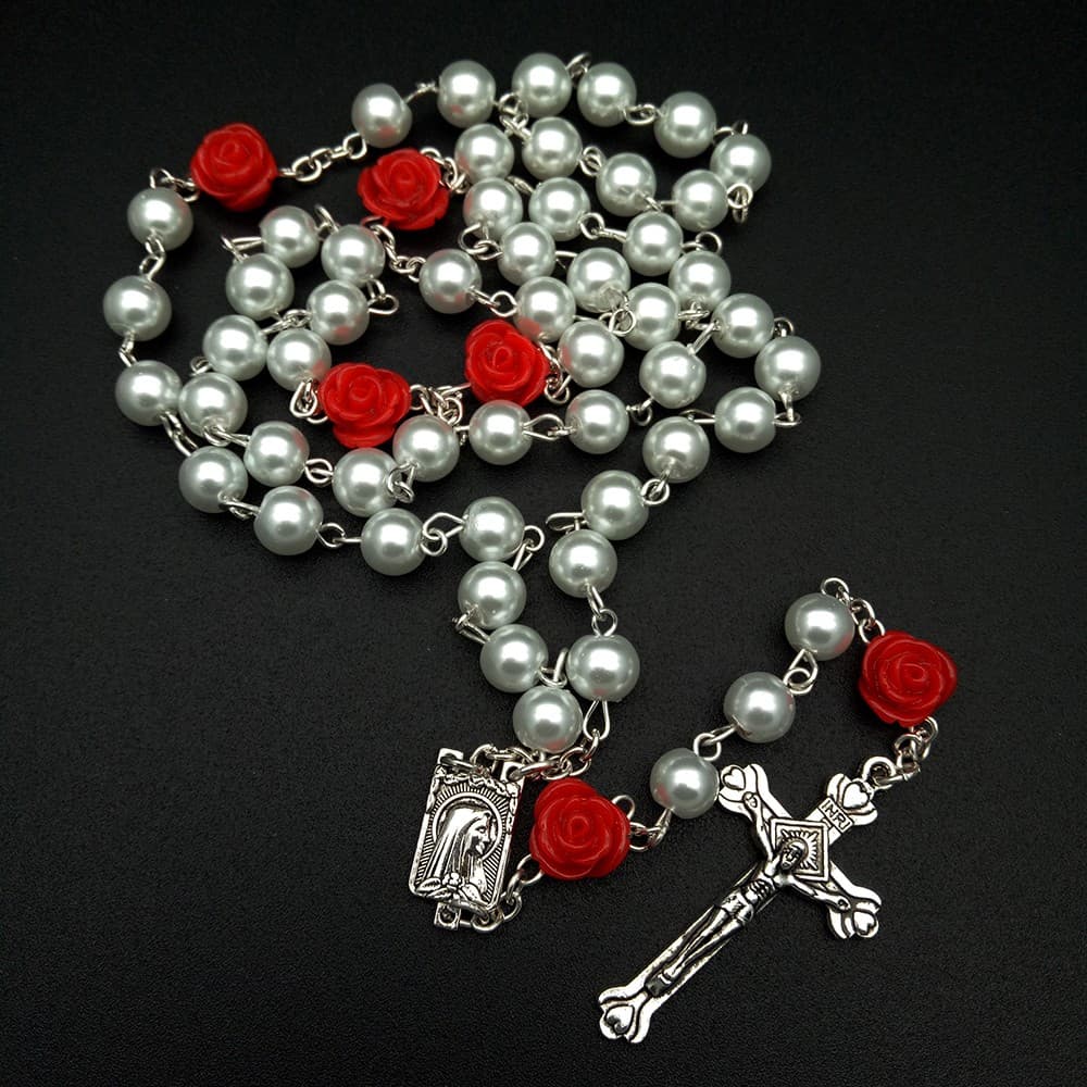 White Rose Cross Rosary with white beads, rose-shaped details, and cross pendant